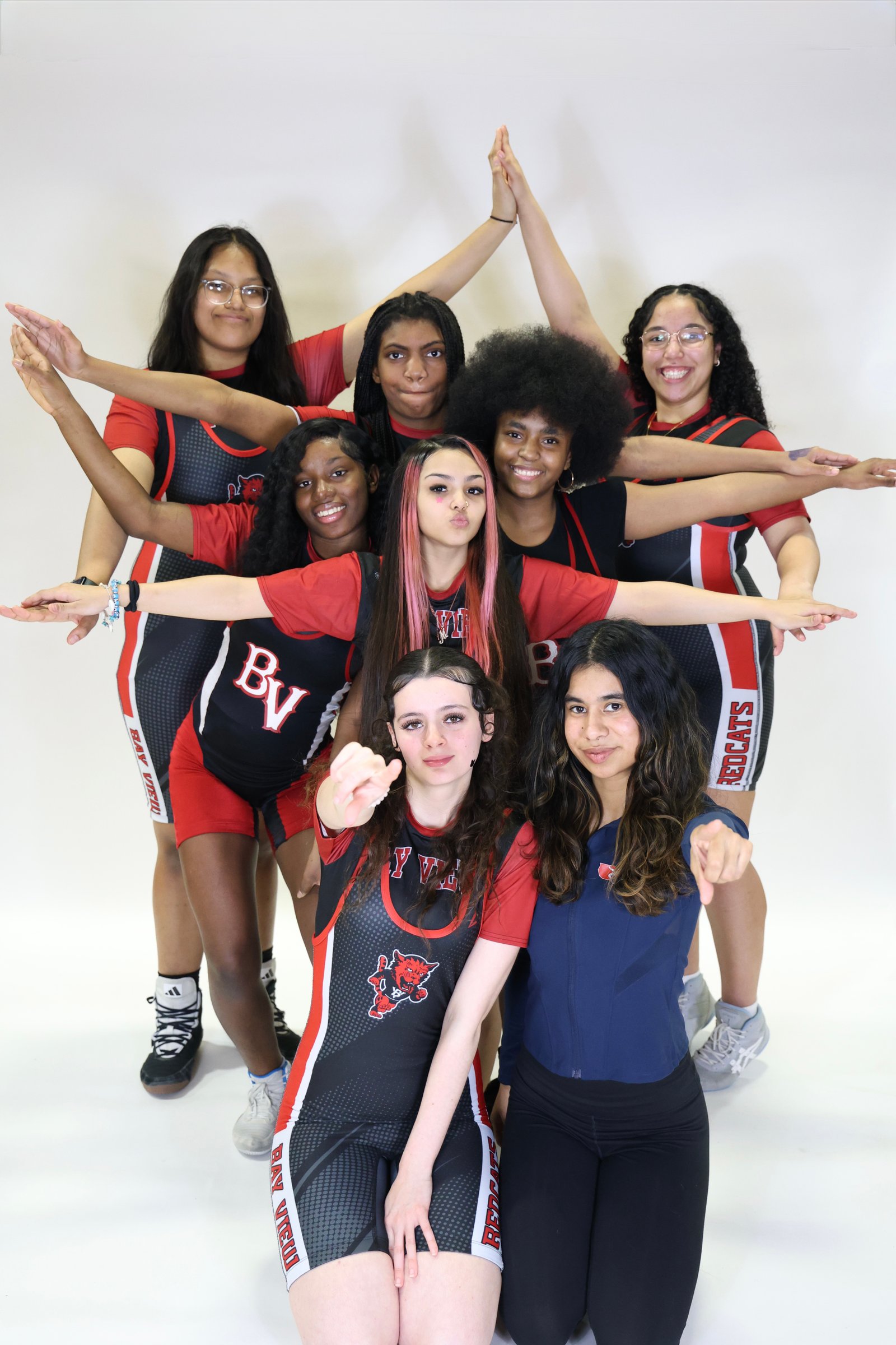 Girls wrestling team in spirited group photo