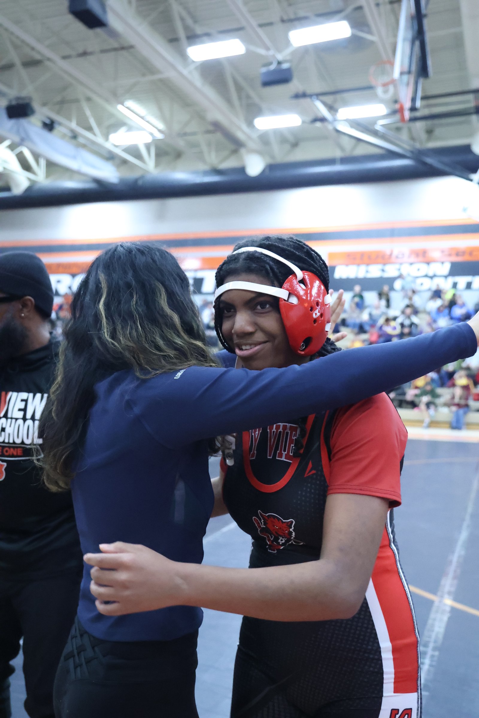 Coach Alex and student in heartfelt moment at competition