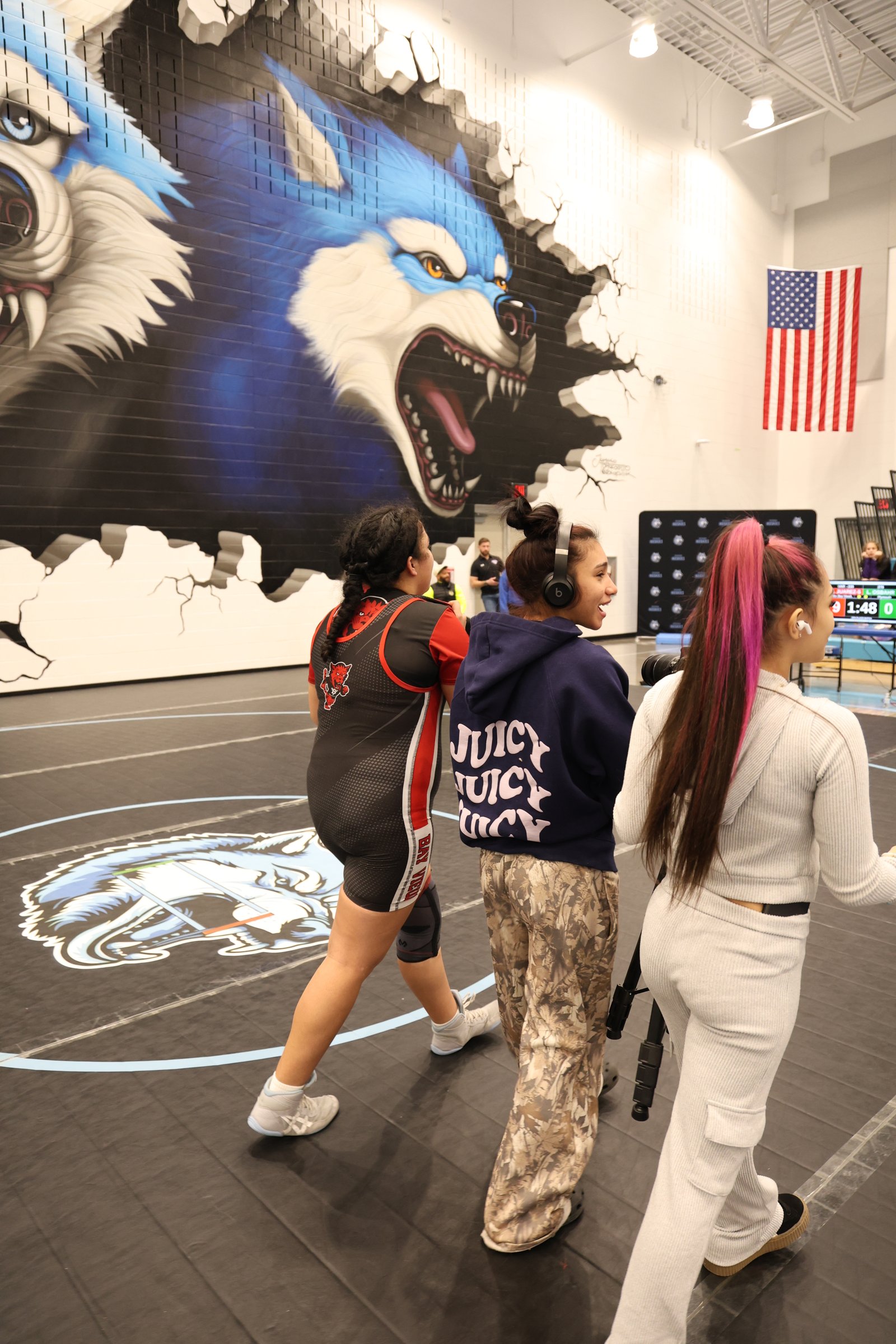 Coach Alex encouraging an athlete at a competition